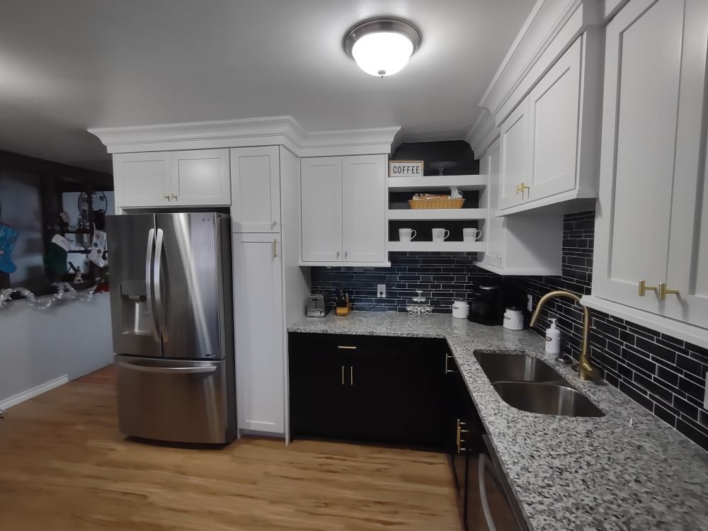 A kitchen with stainless steel appliances and granite counter tops