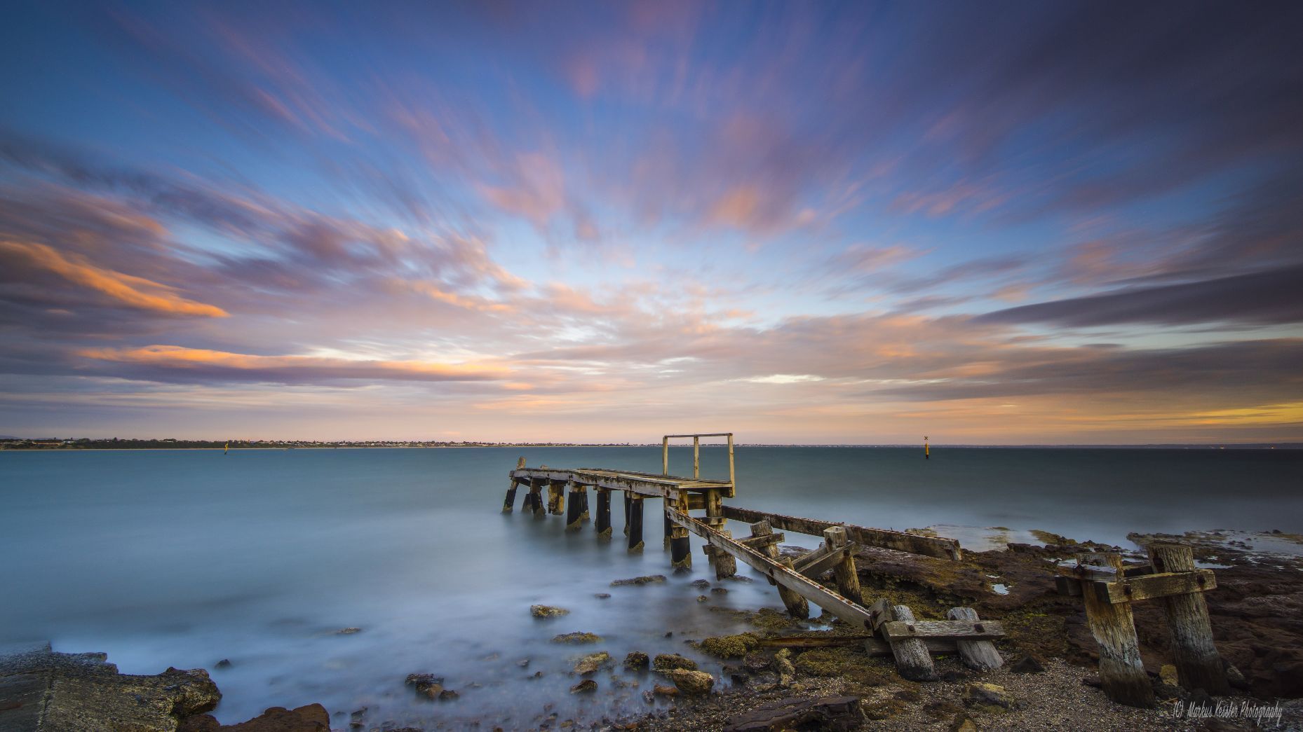 There Is a Pier in The Middle of The Ocean at Sunset — ACG Windows & Glass in Beaumaris, VIC