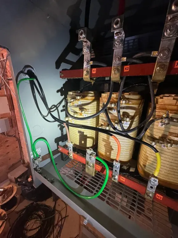 A bunch of wires are connected to a transformer.