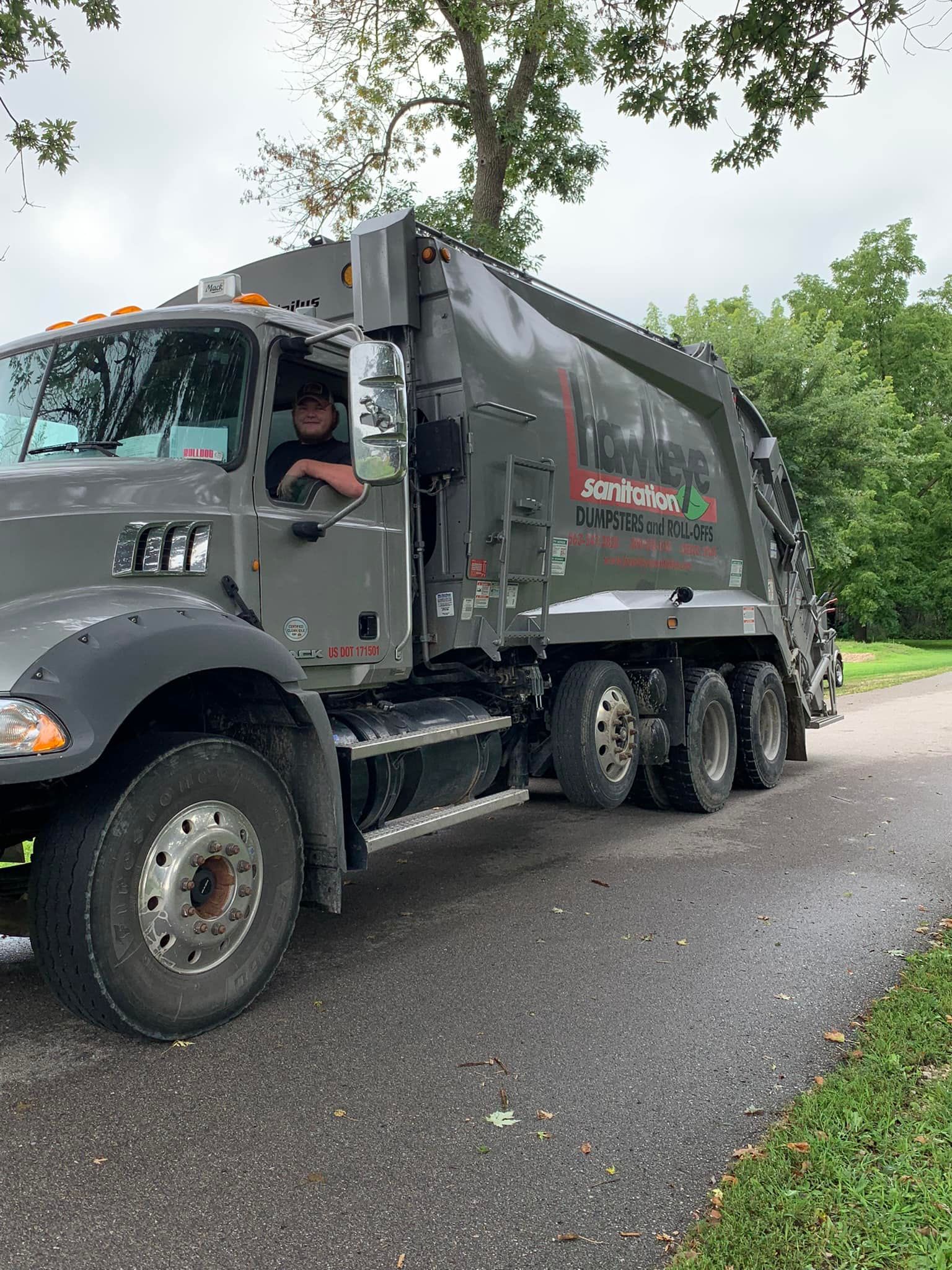Garbage Truck with Driver — Cresco, IA — Hawkeye Sanitation