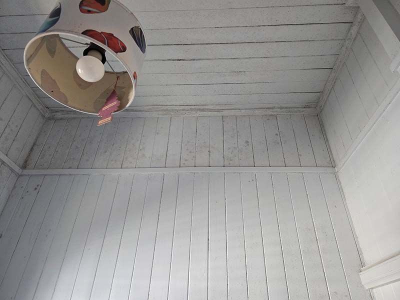 A lamp hanging from the ceiling of a room