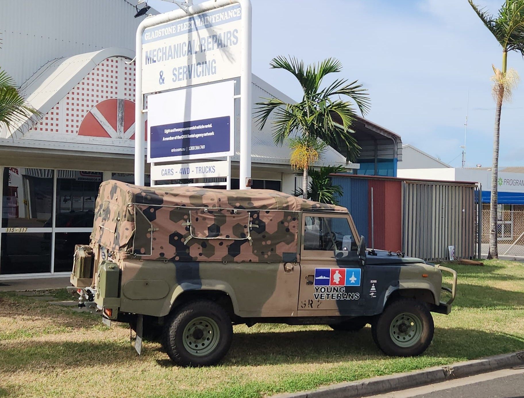 Cars in a garage being worked on, with open hoods. Tools and equipment scattered. — Gladstone Fleet Maintenance In Gladstone, QLD