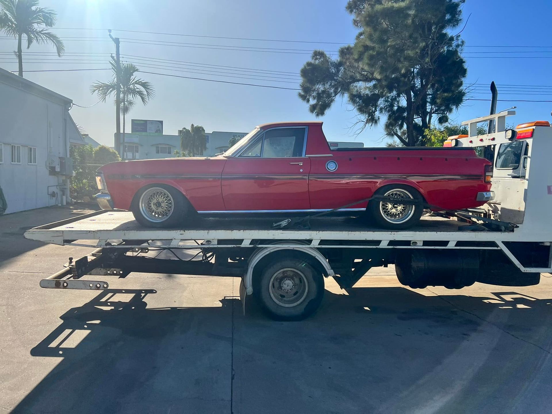 Red Classic Car in a Tilt Tray — Gladstone Fleet Maintenance In Gladstone, QLD