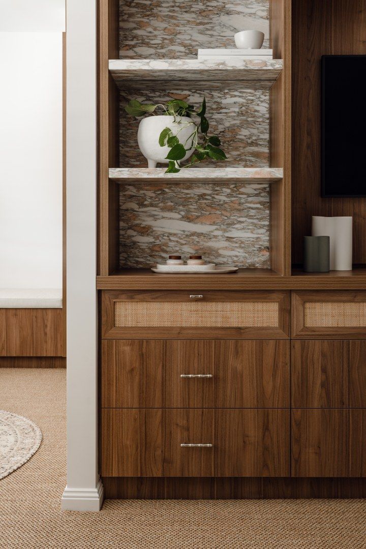 Wood-paneled Built-in Shelves With a White Vase and Green Plant — PKJ Design in Unanderra, NSW