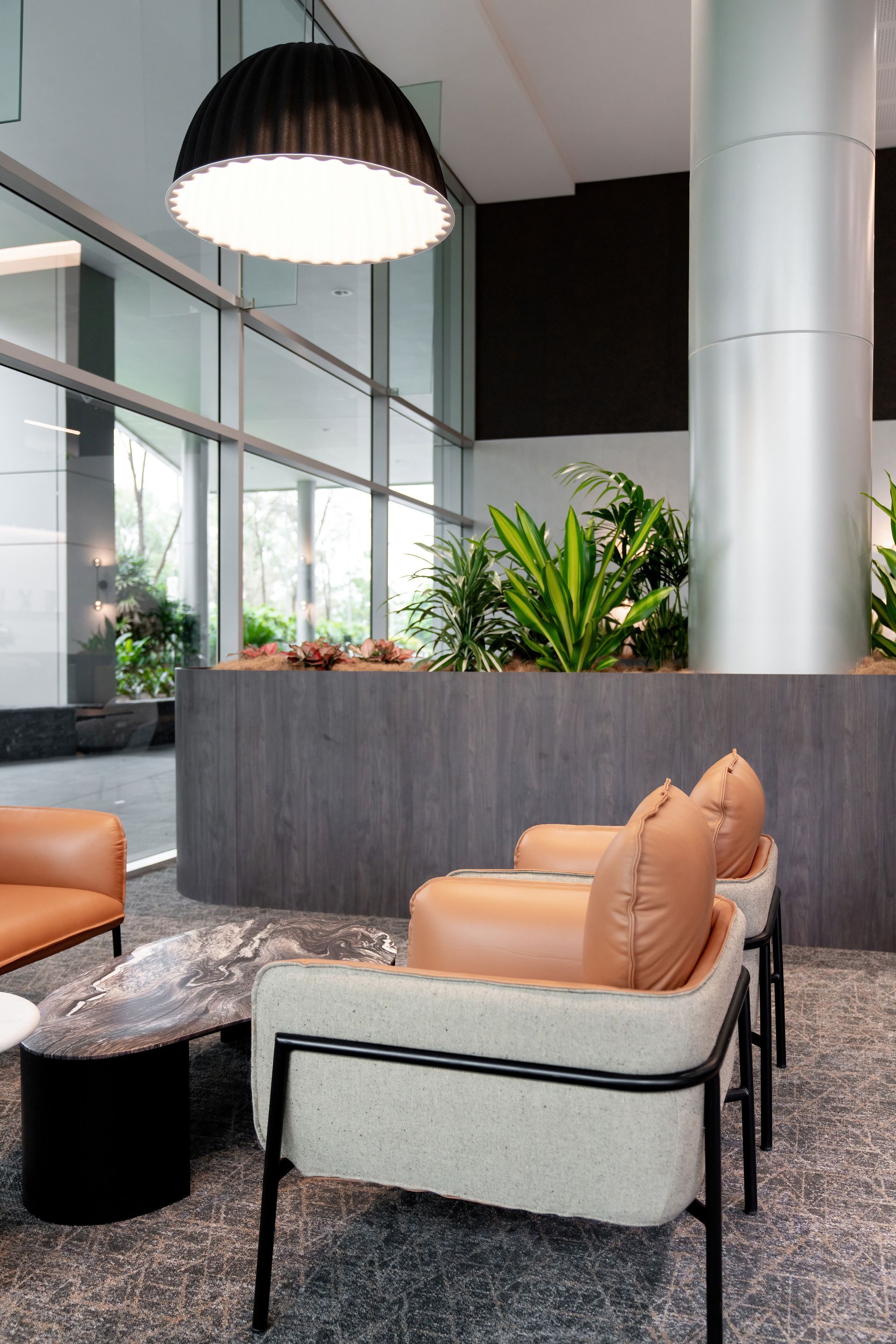 Modern Lobby Seating Area With Tan Chairs — PKJ Design in Unanderra, NSW