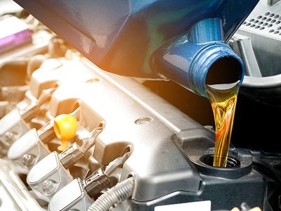 Auto Oil Changes — Pouring Oil Into The Car Engine in Kennett Square, PA
