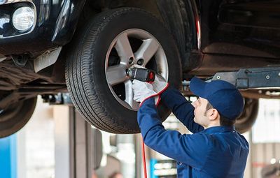 New Tires — Mechanic Changing The Car Tire in Kennett Square, PA