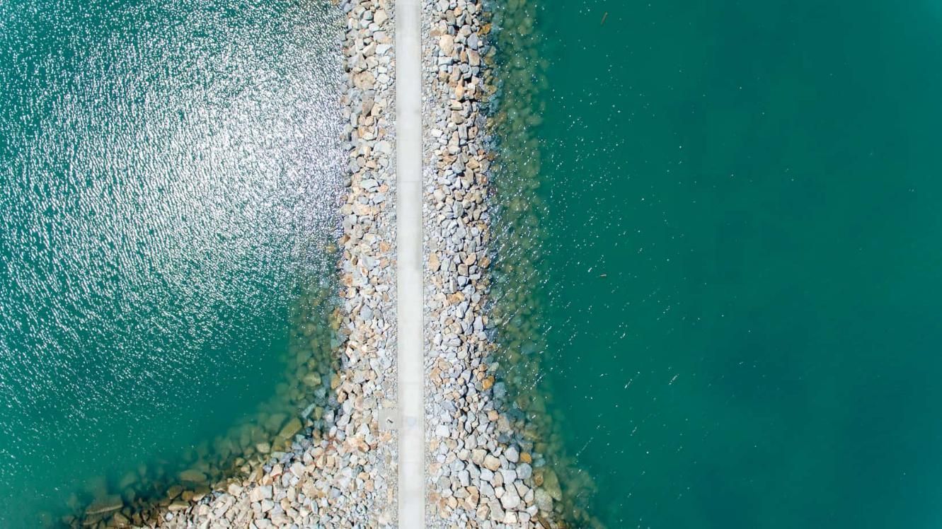 An Aerial View of A Road Going Through a Body of Water — Hillery Group in Bowen, QLD