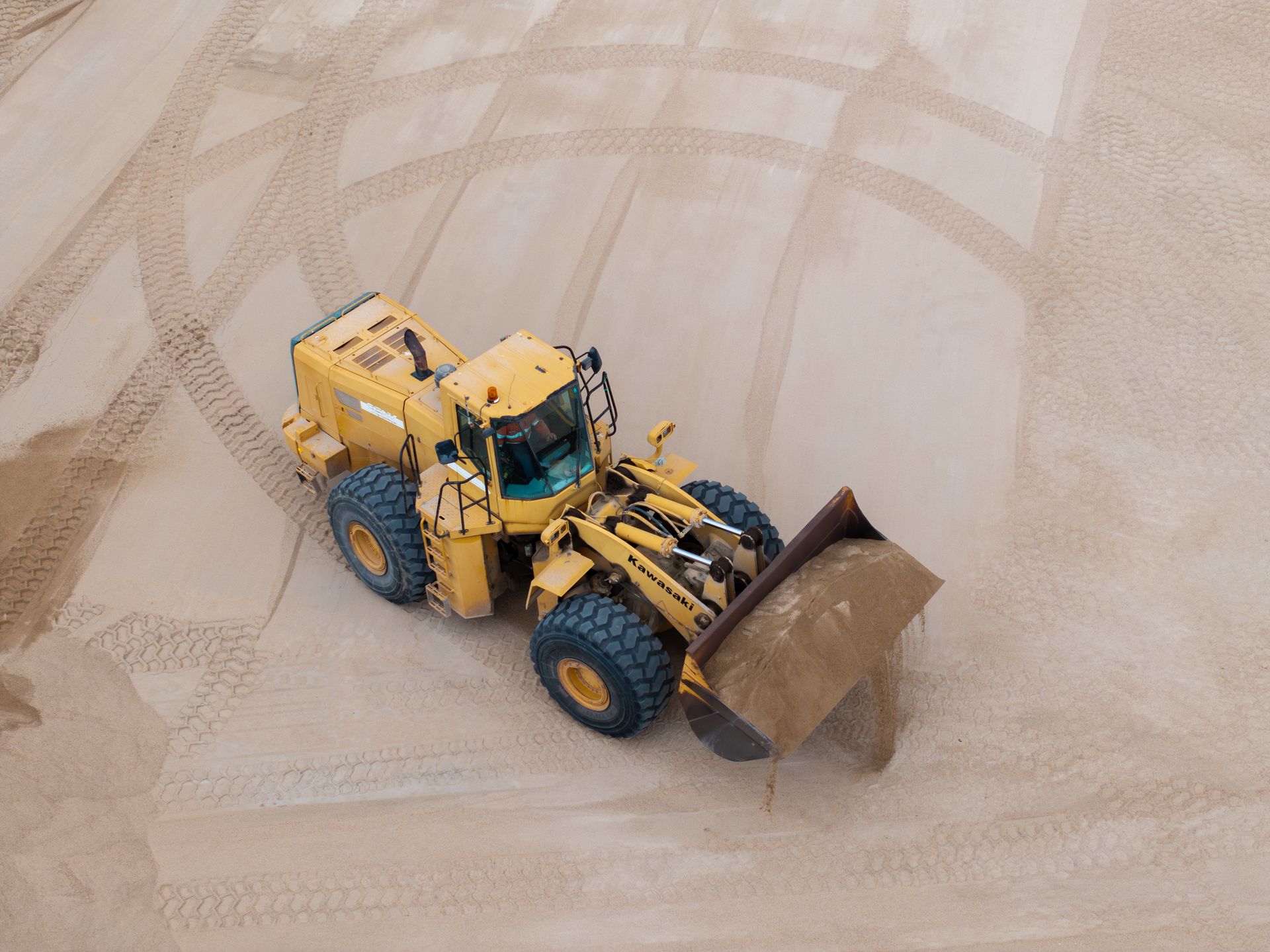 An Excavator Is Digging a Trench in The Dirt — Hillery Group in Bowen, QLD