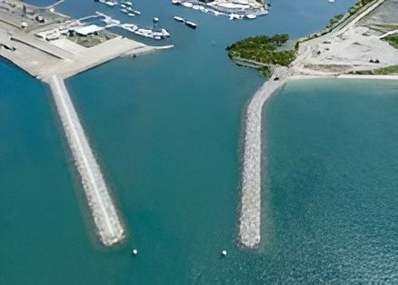 An Aerial View of A Large Body of Water with Boats in It — Hillery Group in Bowen, QLD