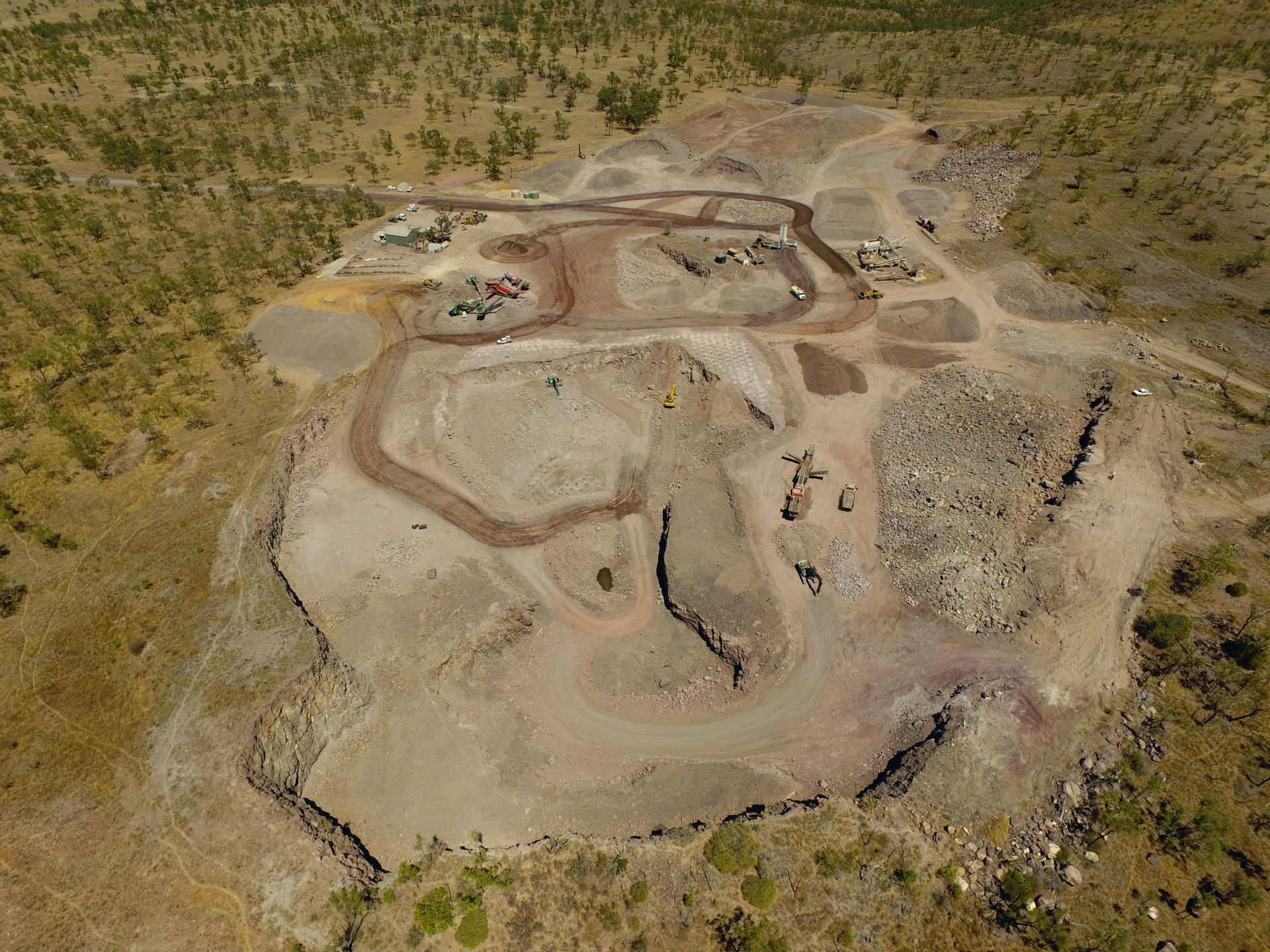 A Yellow Bulldozer is Driving Through a Pile of Sand — Hillery Group in Umina, NSW