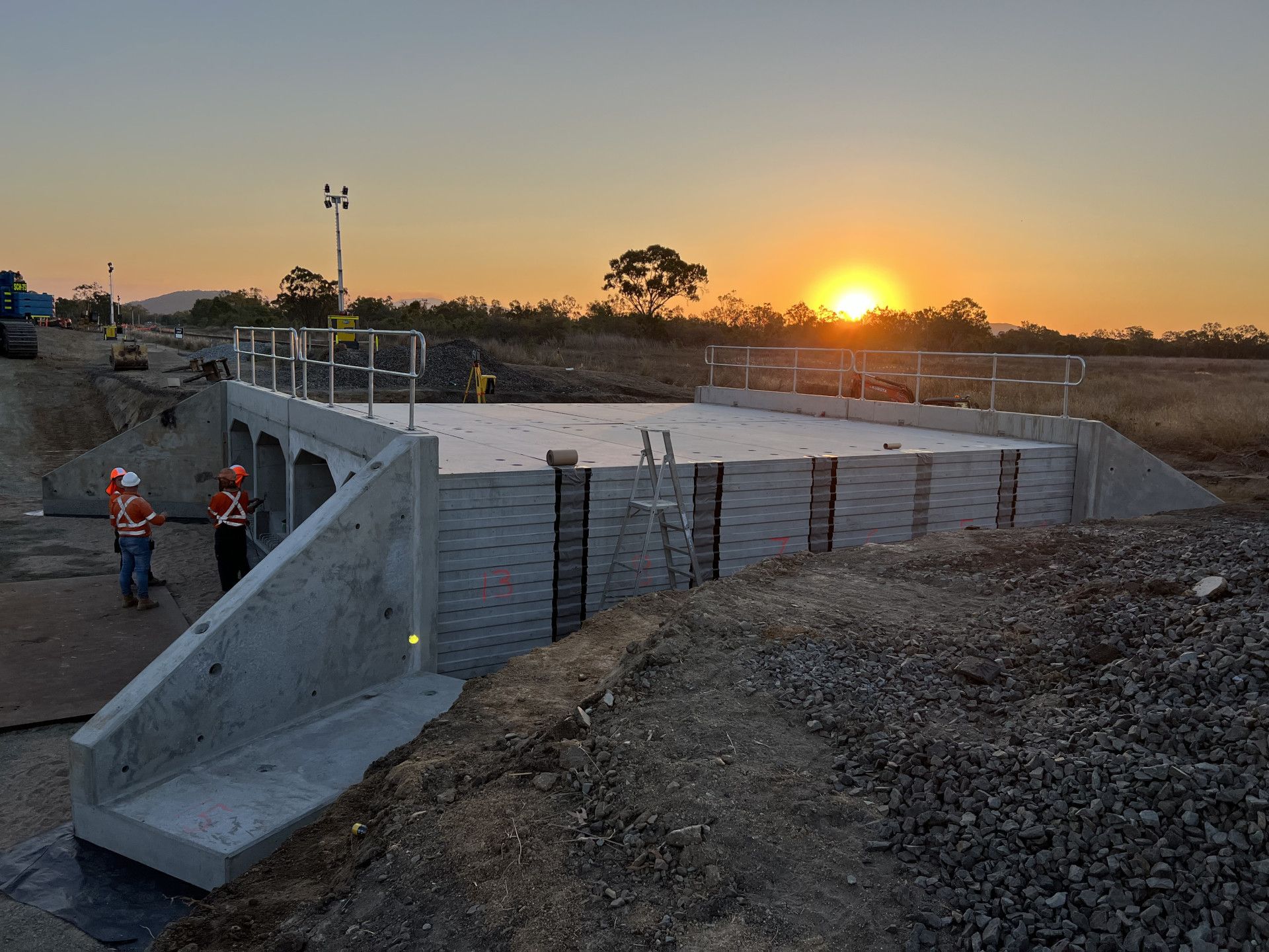 Workers in high vis sunset — Hillery Group in Bowen, QLD