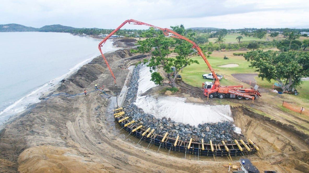 An Aerial View of A Construction Site Next to The Ocean — Hillery Group in Bowen, QLD