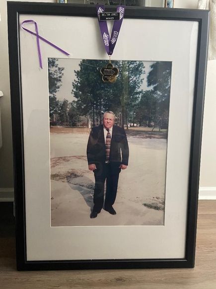 A framed picture of a man in a suit and tie