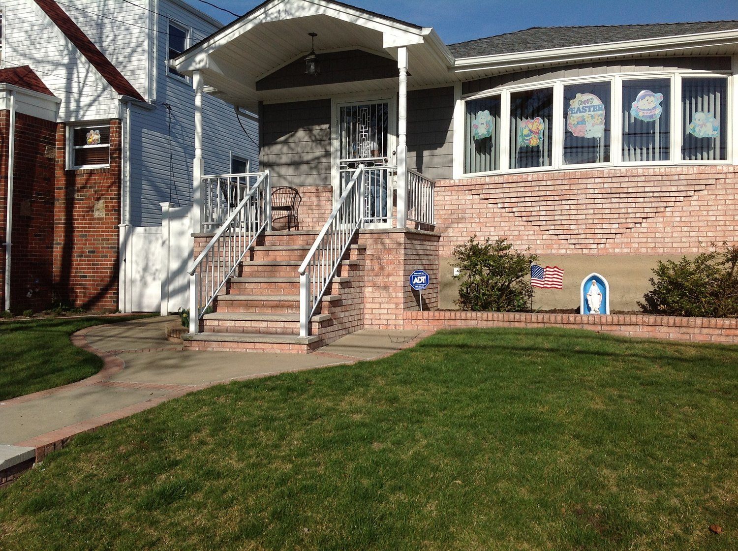 A house with stairs leading up to the front door