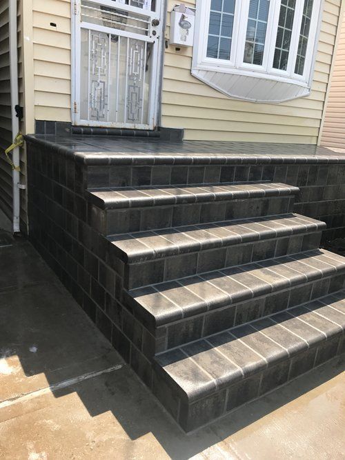 A set of stairs leading up to a house.