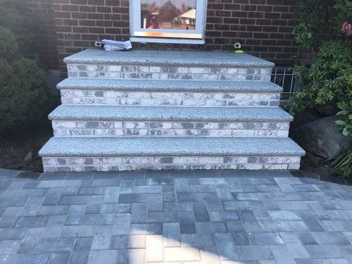 A set of stairs leading up to a brick building.