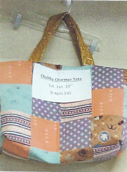 A lined boxy zipper bag is sitting on a table.