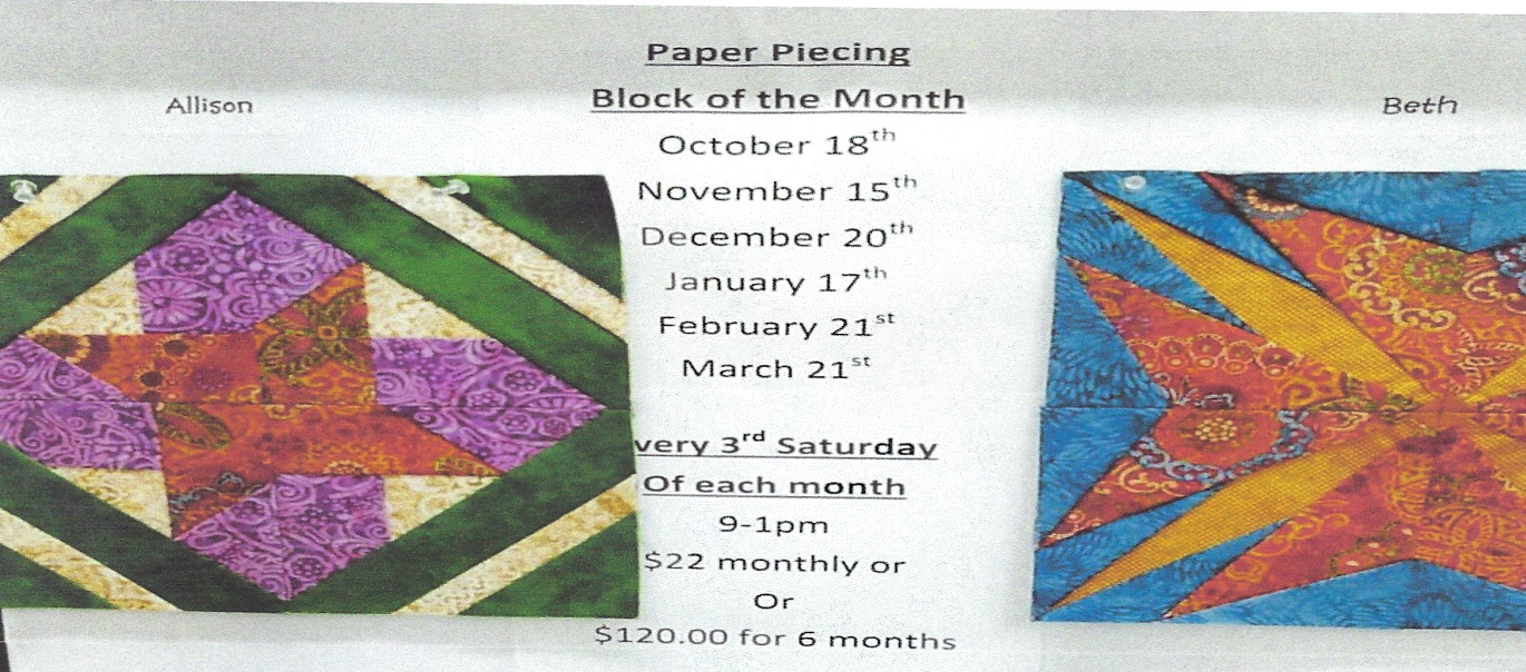 A quilt with rabbits on it is hanging on a wall.