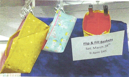 A stained glass applique square with a blue and black design on it.