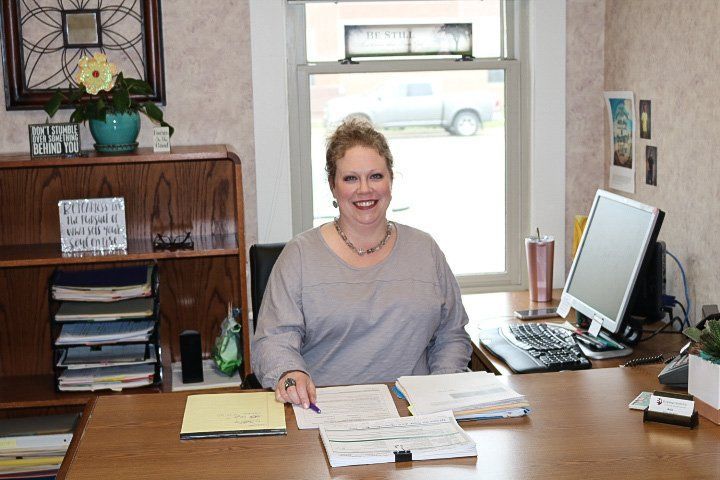 Woman Is Sitting at A Desk