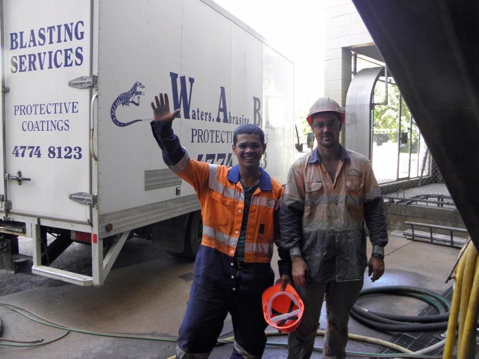 Two Men Standing in Front of a Blasting Services Truck — Waters Abrasive Blasting Services In Bundaberg, QLD