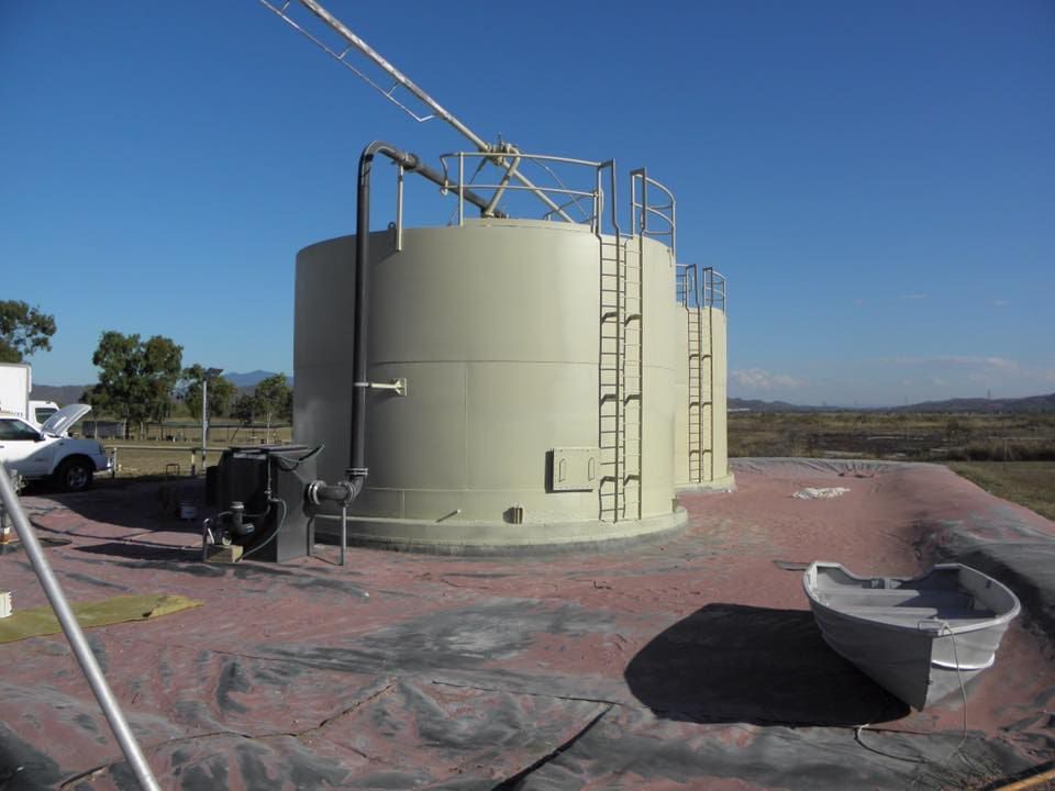 A Large Tank With a Ladder on Top of It — Waters Abrasive Blasting Services In Shaw, QLD