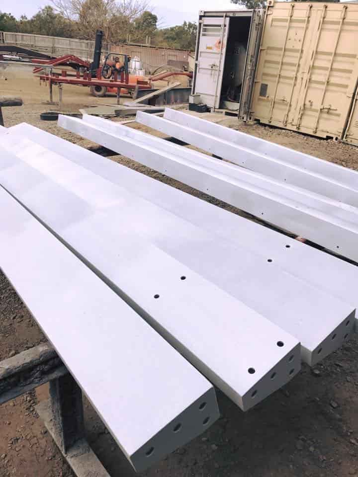 A Bunch of White Pieces of Metal Are Sitting on the Ground — Waters Abrasive Blasting Services In Shaw, QLD