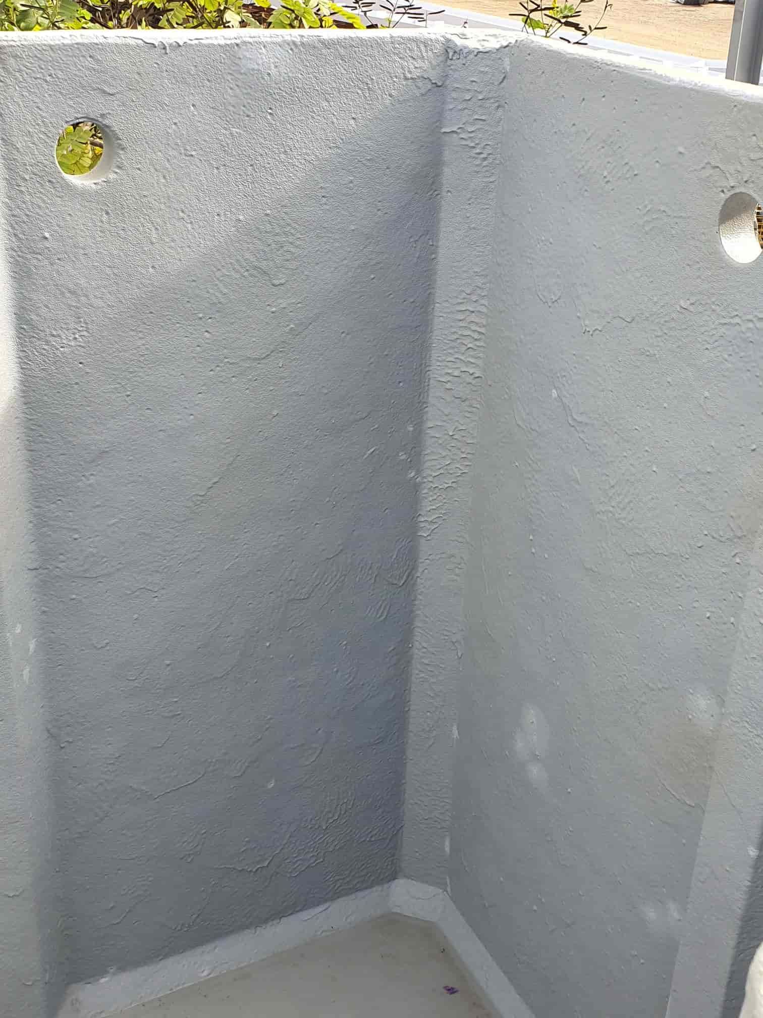 A Corner of a Concrete Wall With Holes in It — Waters Abrasive Blasting Services In Darwin, NT