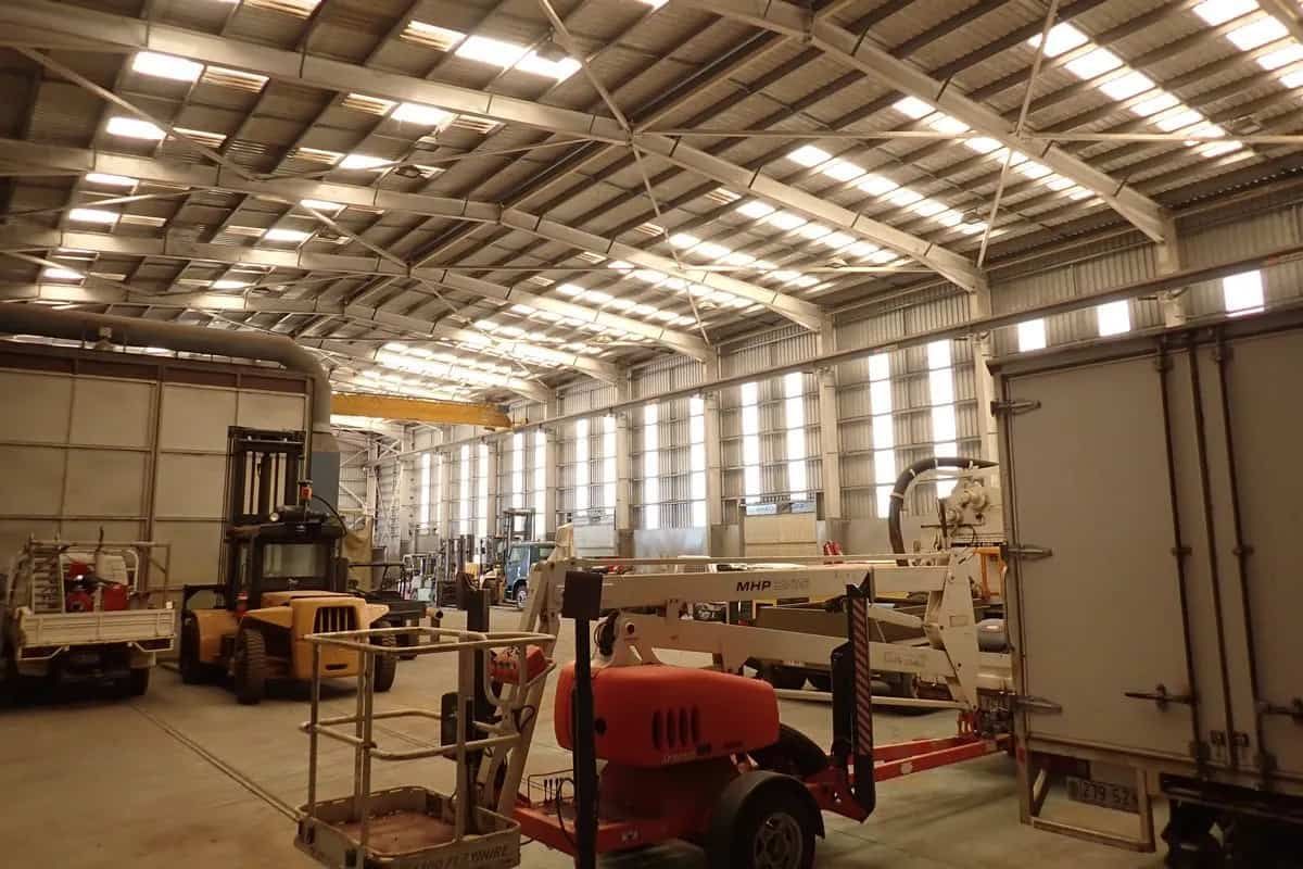 A Large Warehouse With a Lot of Machinery in It — Waters Abrasive Blasting Services In Shaw, QLD