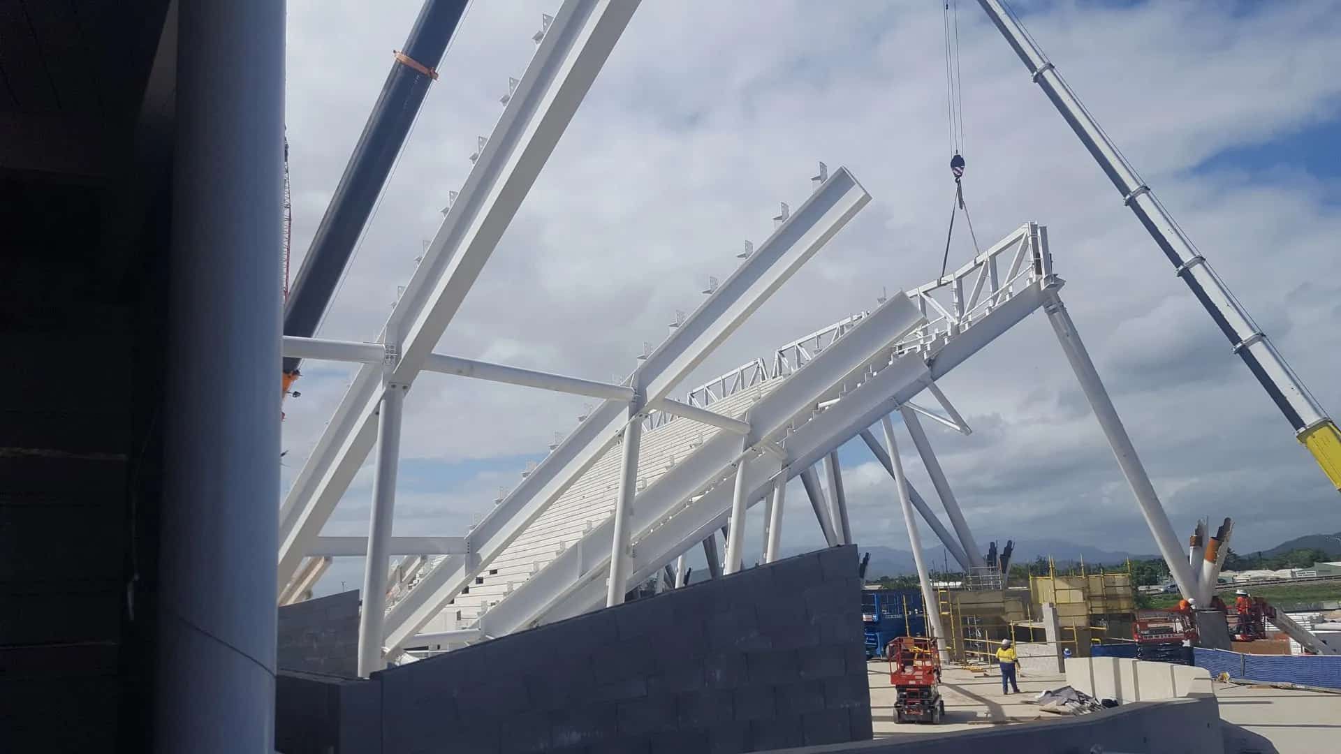 A Large Metal Structure is Being Built by a Crane — Waters Abrasive Blasting Services In Shaw, QLD