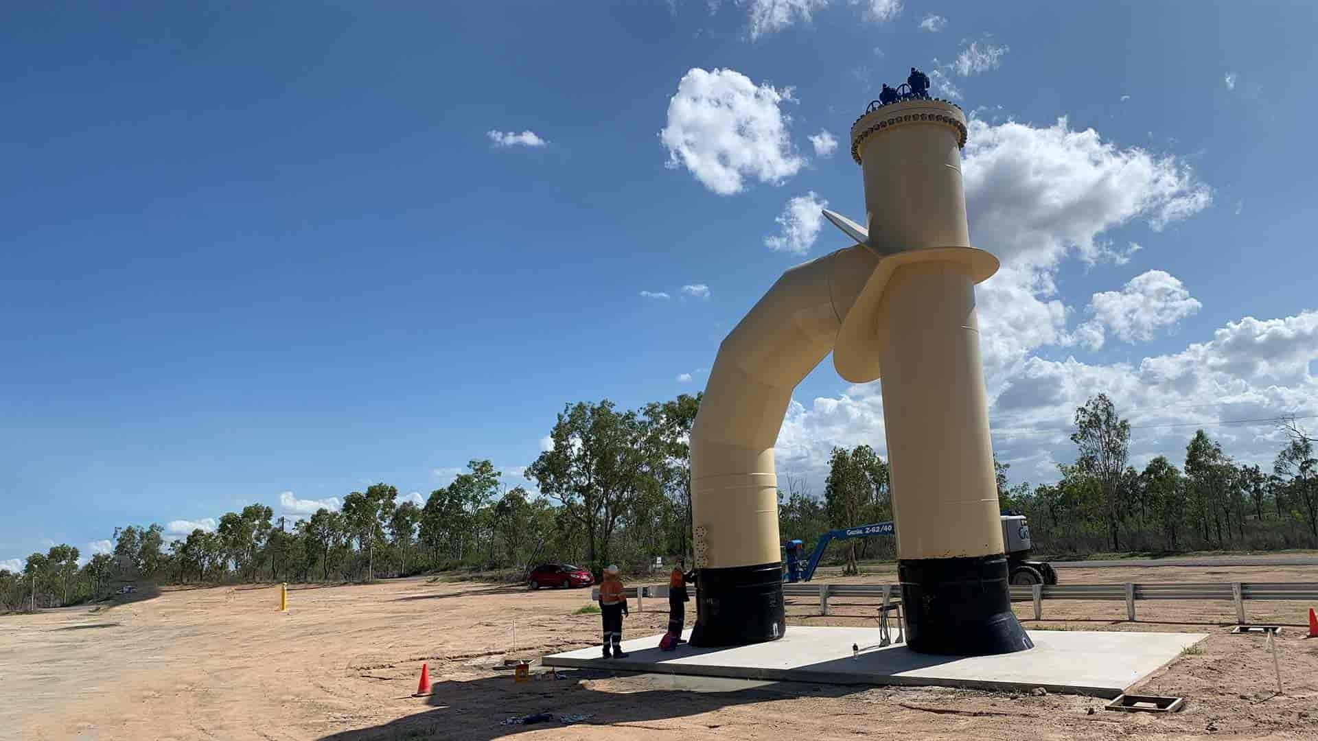 A Large Pipe is Being Built in the Middle of a Field — Waters Abrasive Blasting Services In Shaw, QLD