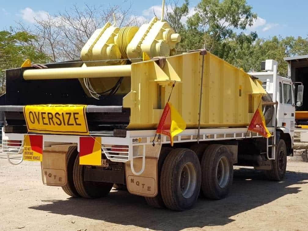 A Yellow Truck Has a Sign on the Back That Says Oversize — Waters Abrasive Blasting Services In Shaw, QLD
