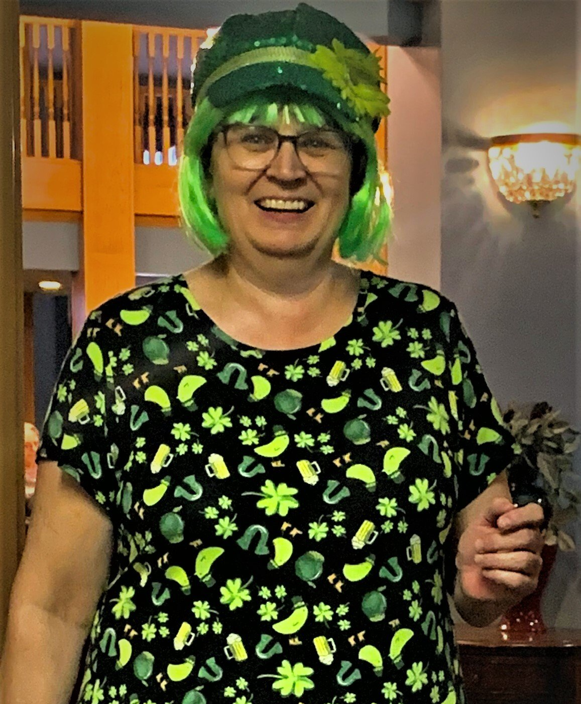 Woman Wearing Fun & Festive Shirt, Hat & Wig on St. Patrick's Day