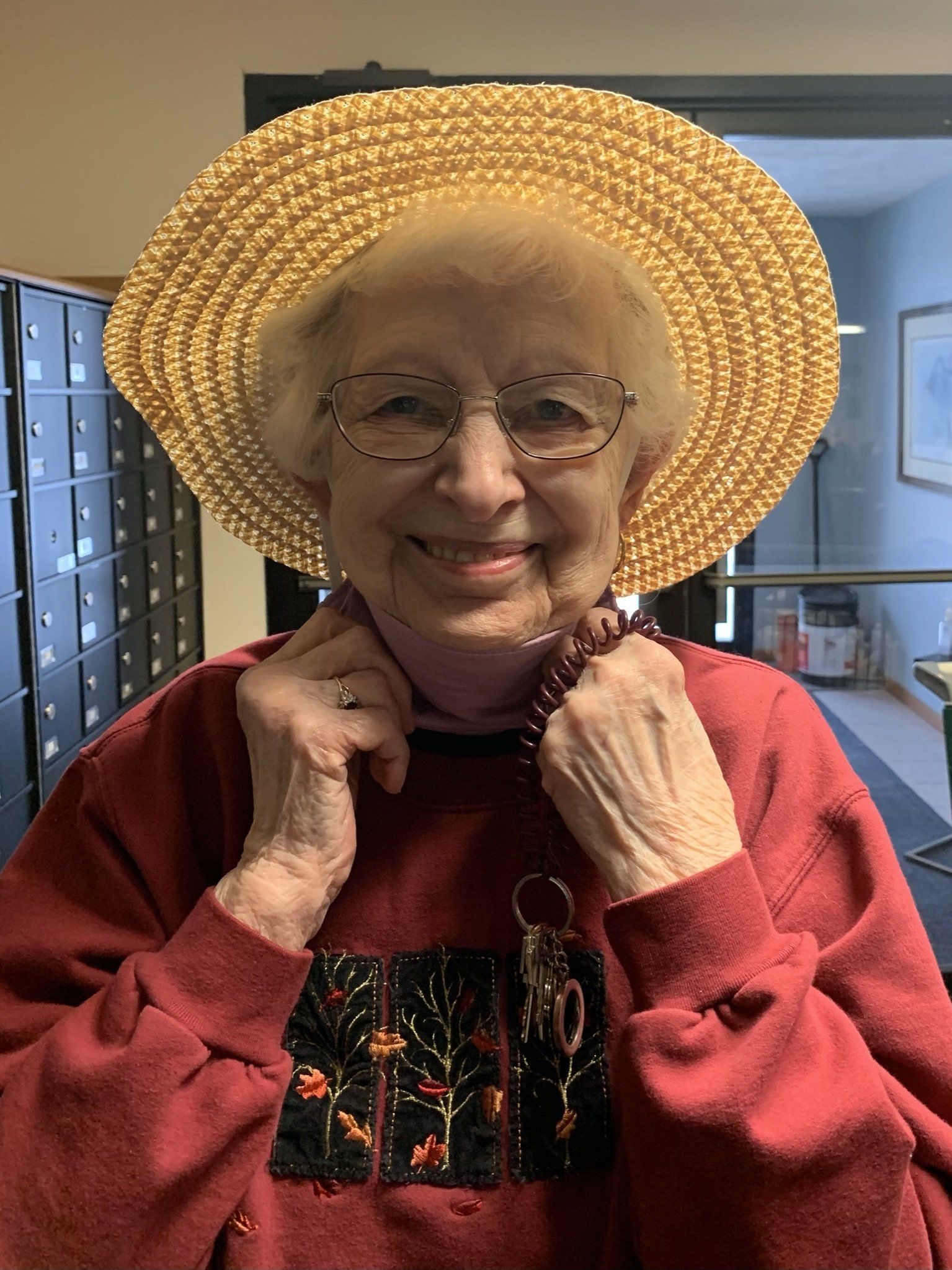Elderly Woman Wearing Wicker Farmers Hat