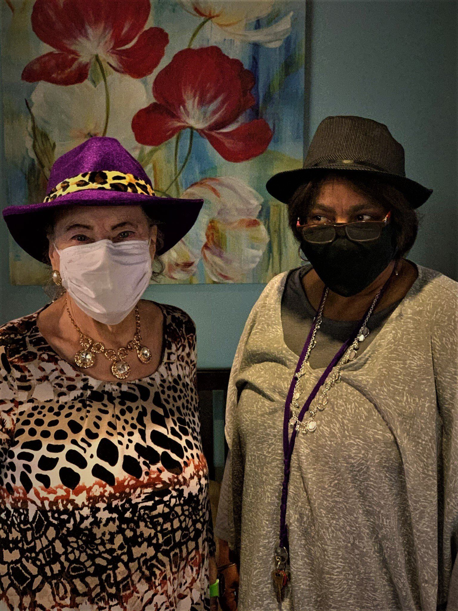 Two Senior Women Wearing Fun Hats
