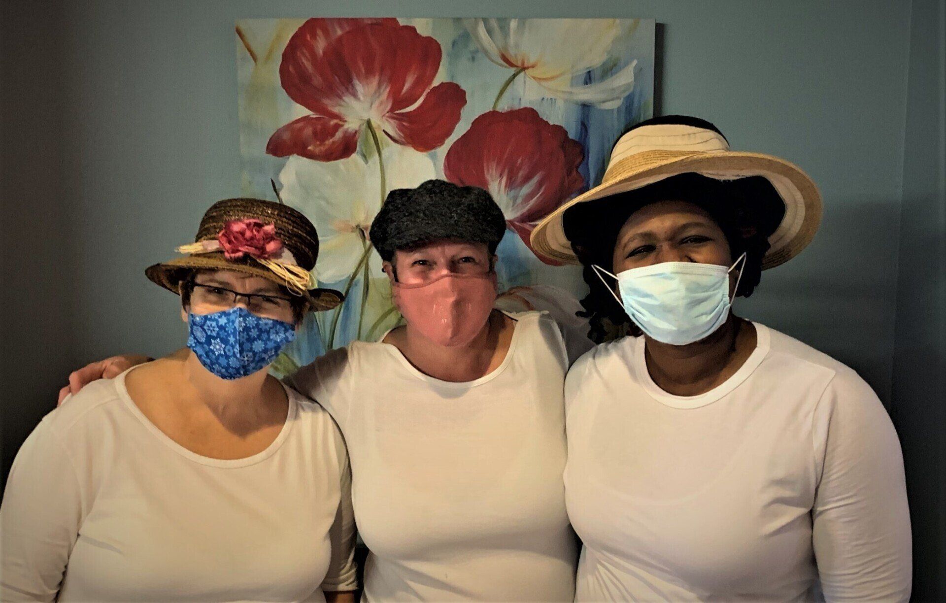 Group of Women Wearing White Shirts & Fun Hats
