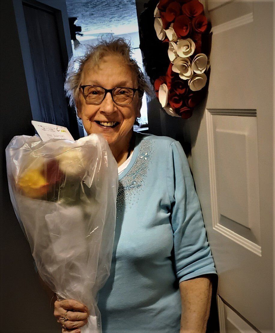 Senior Woman with Bouquet of Flowers