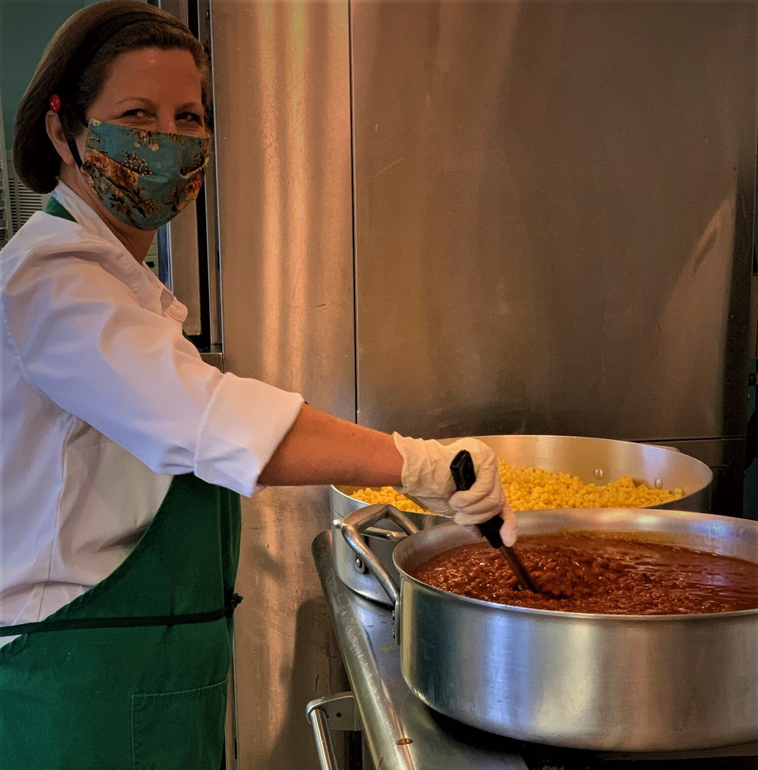 Cook Stirring Large Pots of Beans & Corn