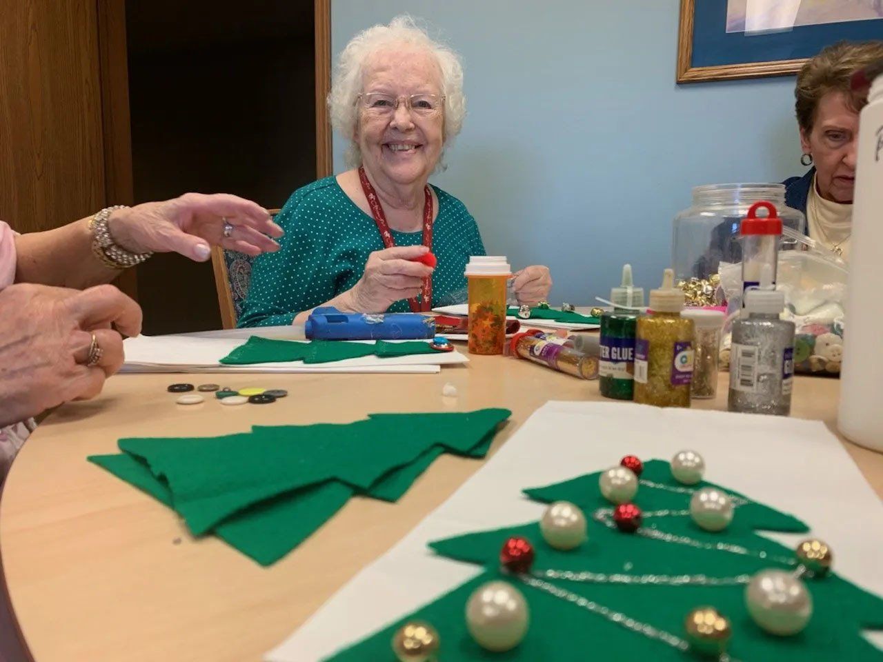 Happy Seniors Enjoying Christmas Tree Craft