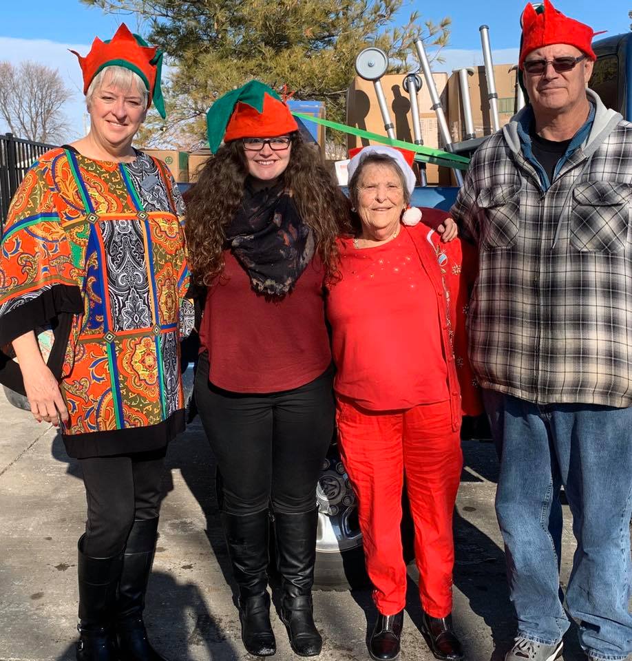 Happy Senior & Family with Elf & Santa Hats