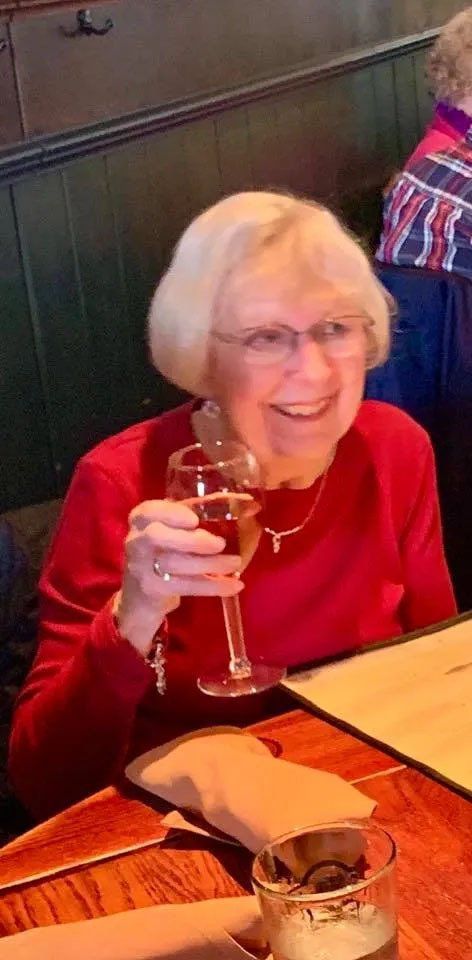 Happy Senior Woman Enjoying a Glass of Wine