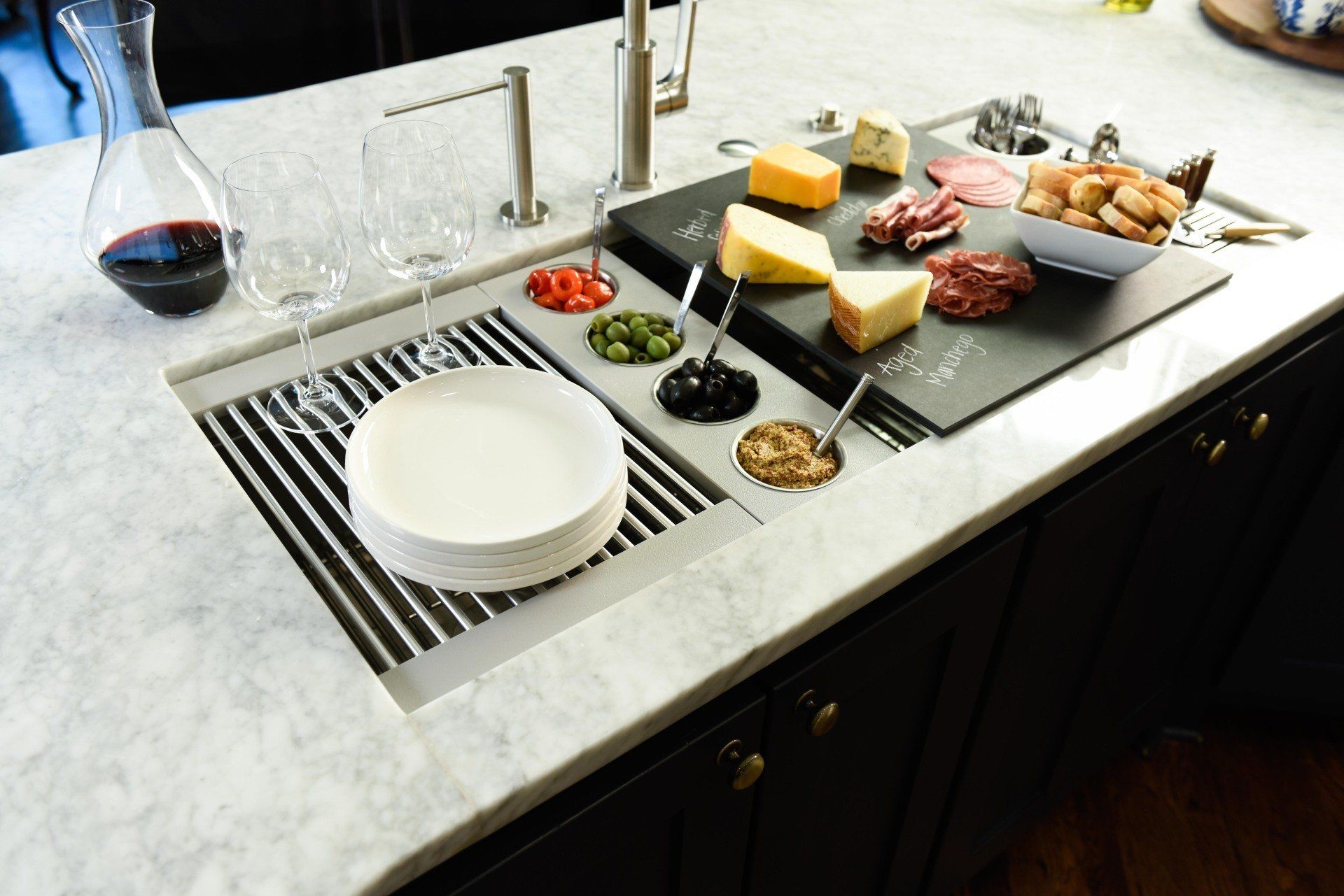 A kitchen sink with a tray of food on it