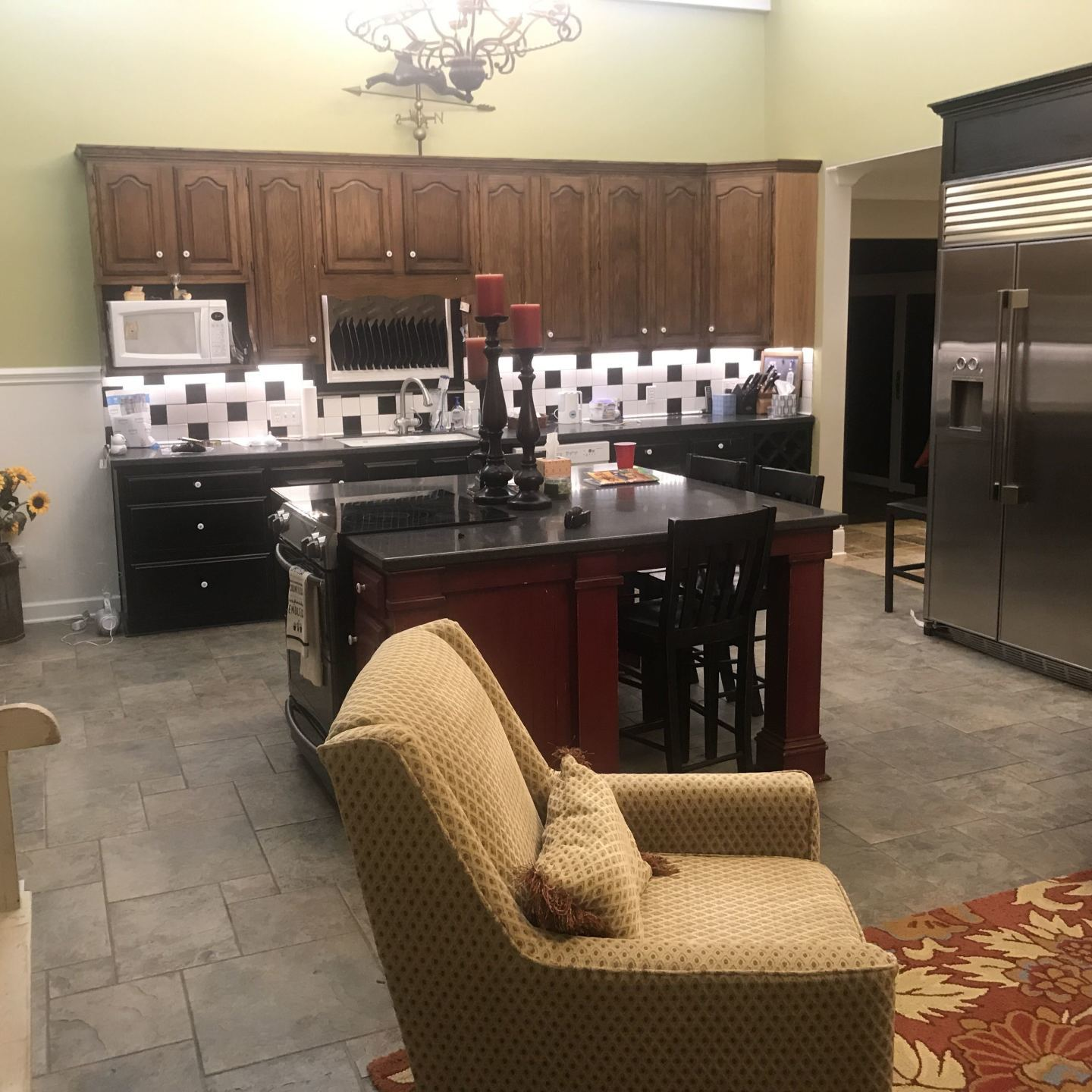 A kitchen with stainless steel appliances and wooden cabinets