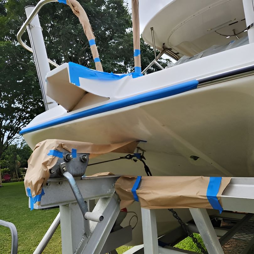 A Boat With Blue Tape on It is Sitting on a Trailer — Baran Yachting in Manly, QLD