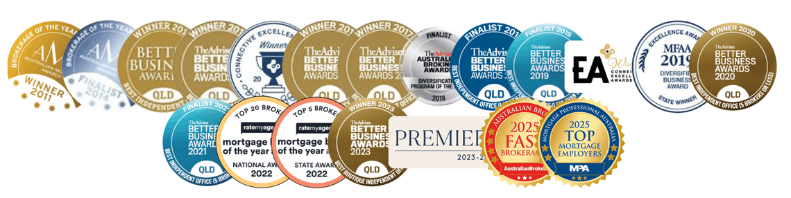 A bunch of awards are lined up in a row on a white background.