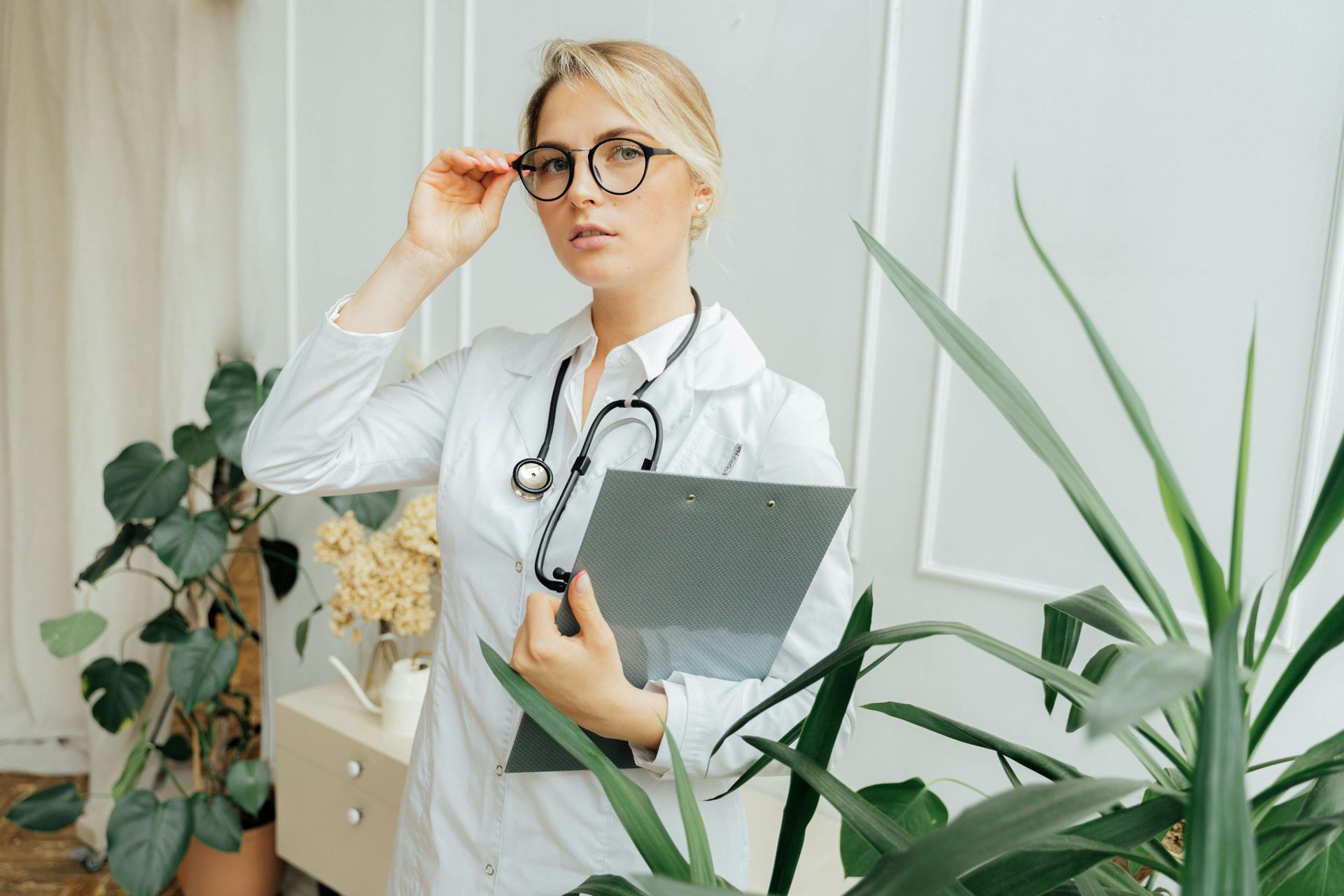 female doctor: Logan brokers help doctors and medical professionals with home loans.