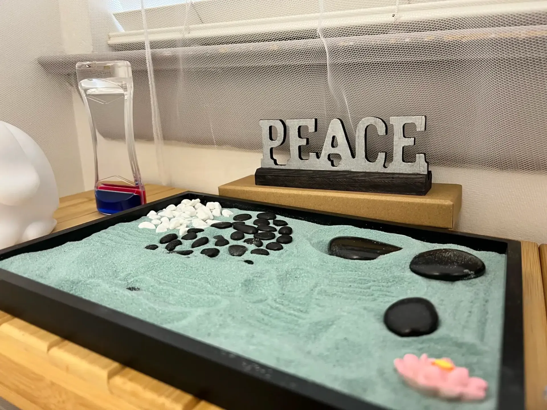 Zen garden with rocks, blue sand, 