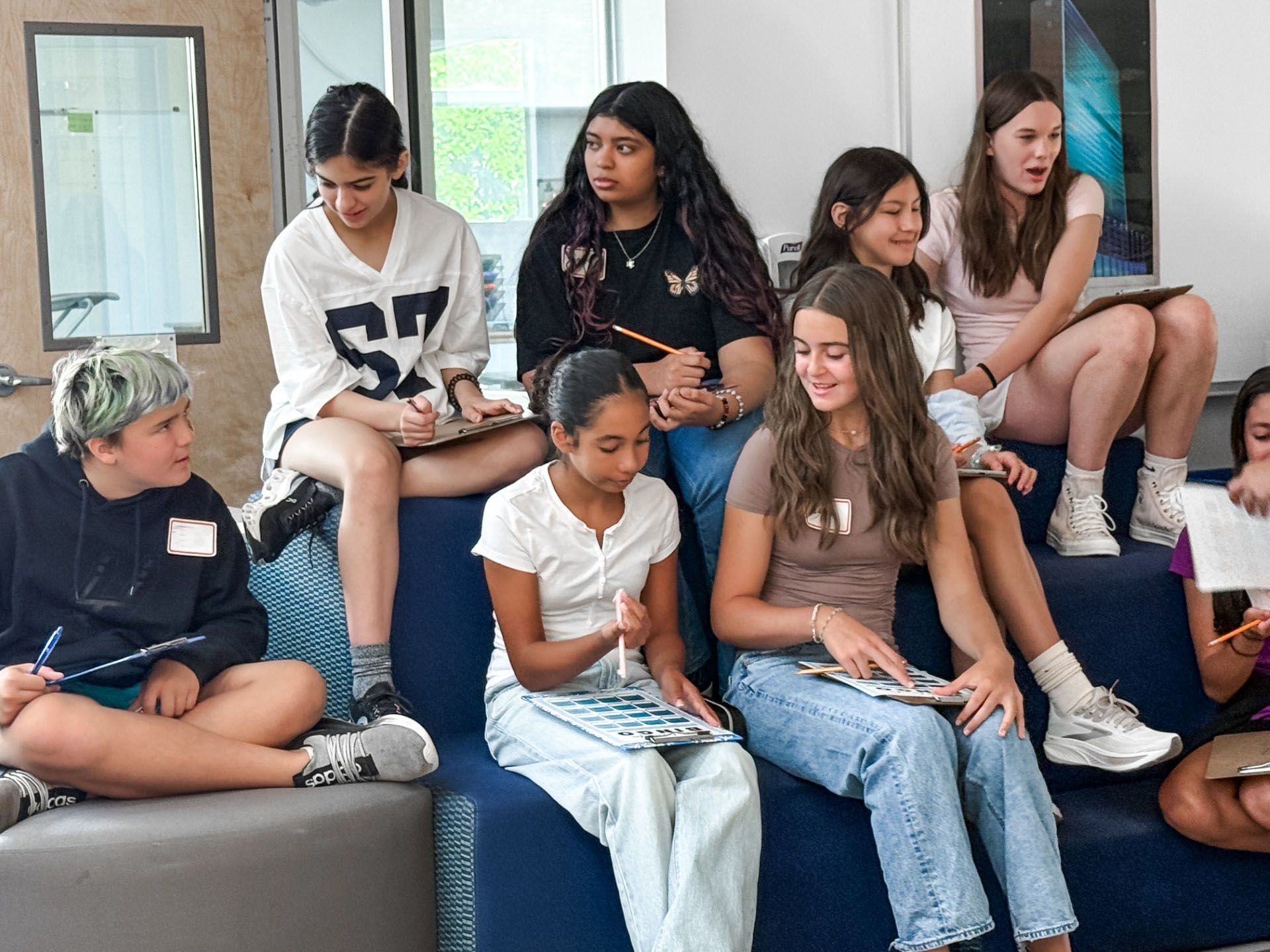 A group of girls sitting together.