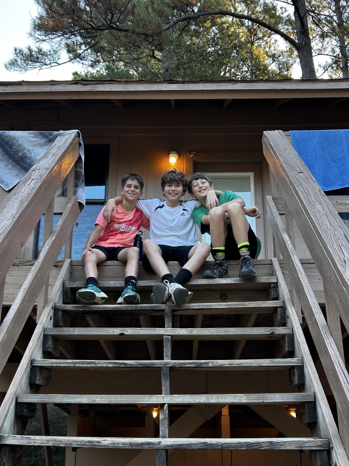 Children in costumes on a stage. Costumes include a rabbit, king, and Mad Hatter.